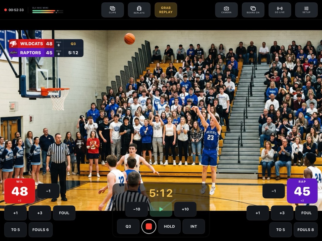 Basketball game with The Stack scoreboard burned into the picture.