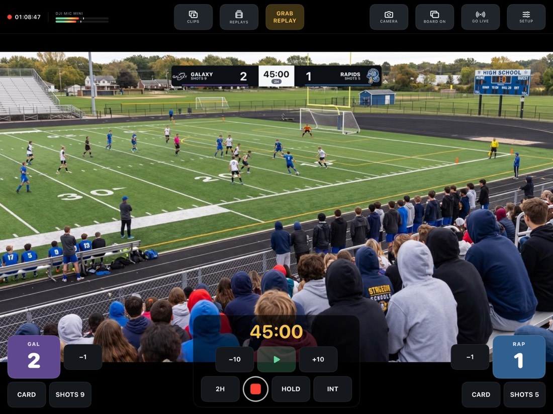 Soccer match with The Marquee scoreboard burned into the picture.